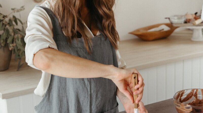 Camille Styles frosting a grain-free chocolate cake_libido-enhancing Valentine