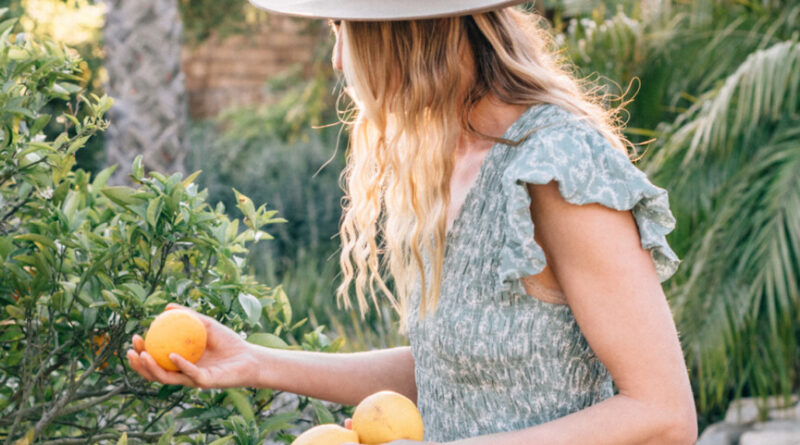 Woman picking lemons