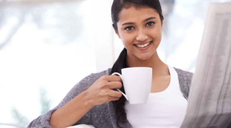 smiling woman drinking coffee Sunday things to do