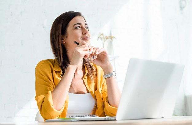 A thoughtful woman at work.
