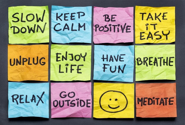 A collection of post-its with uplifting messages.