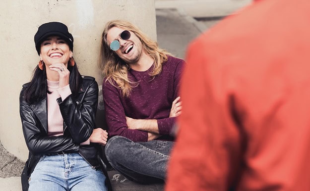Smiling and laughing friends outdoors.