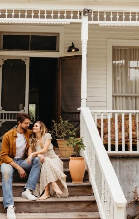 Couple smiling on front porch