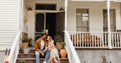 Couple smiling on front porch