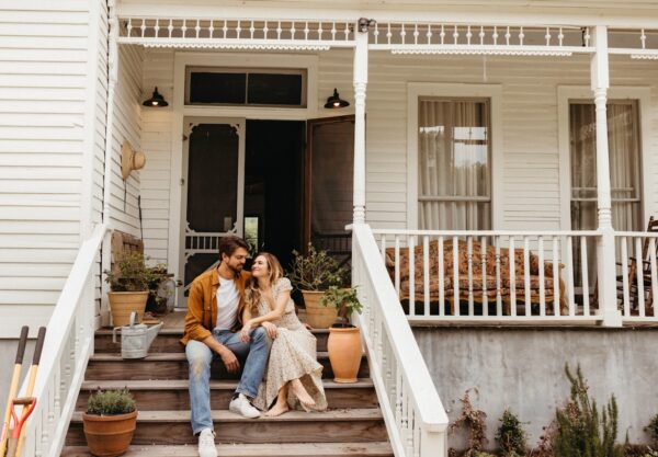 Couple smiling on front porch