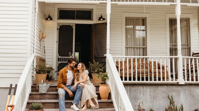 Couple smiling on front porch