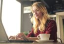 A focused woman working on her laptop.