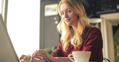 A focused woman working on her laptop.